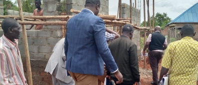 District Heads touring the Ward under construction at Buyobe HCIl